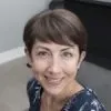 Kim Sopman, a holistic sleep coach, smiling