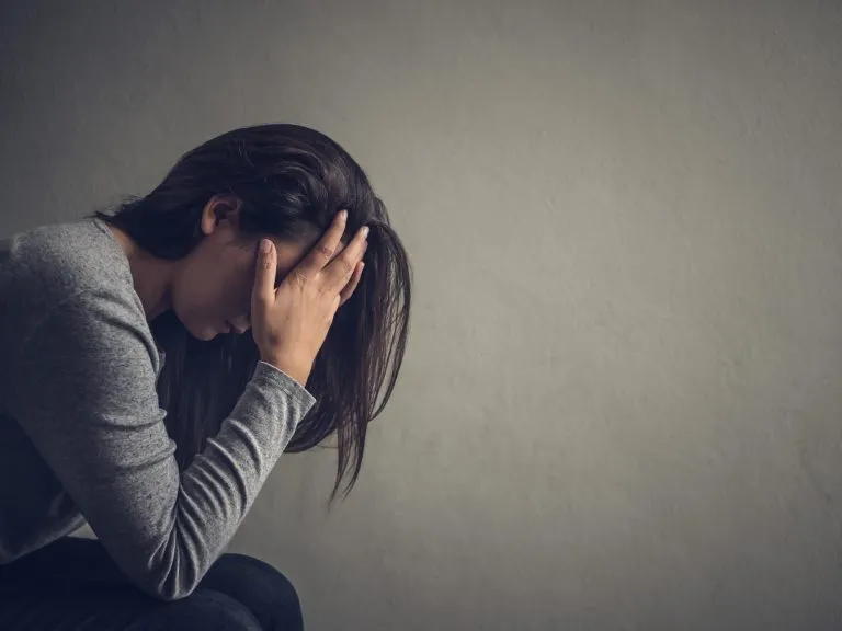 A person meditating, representing mental health